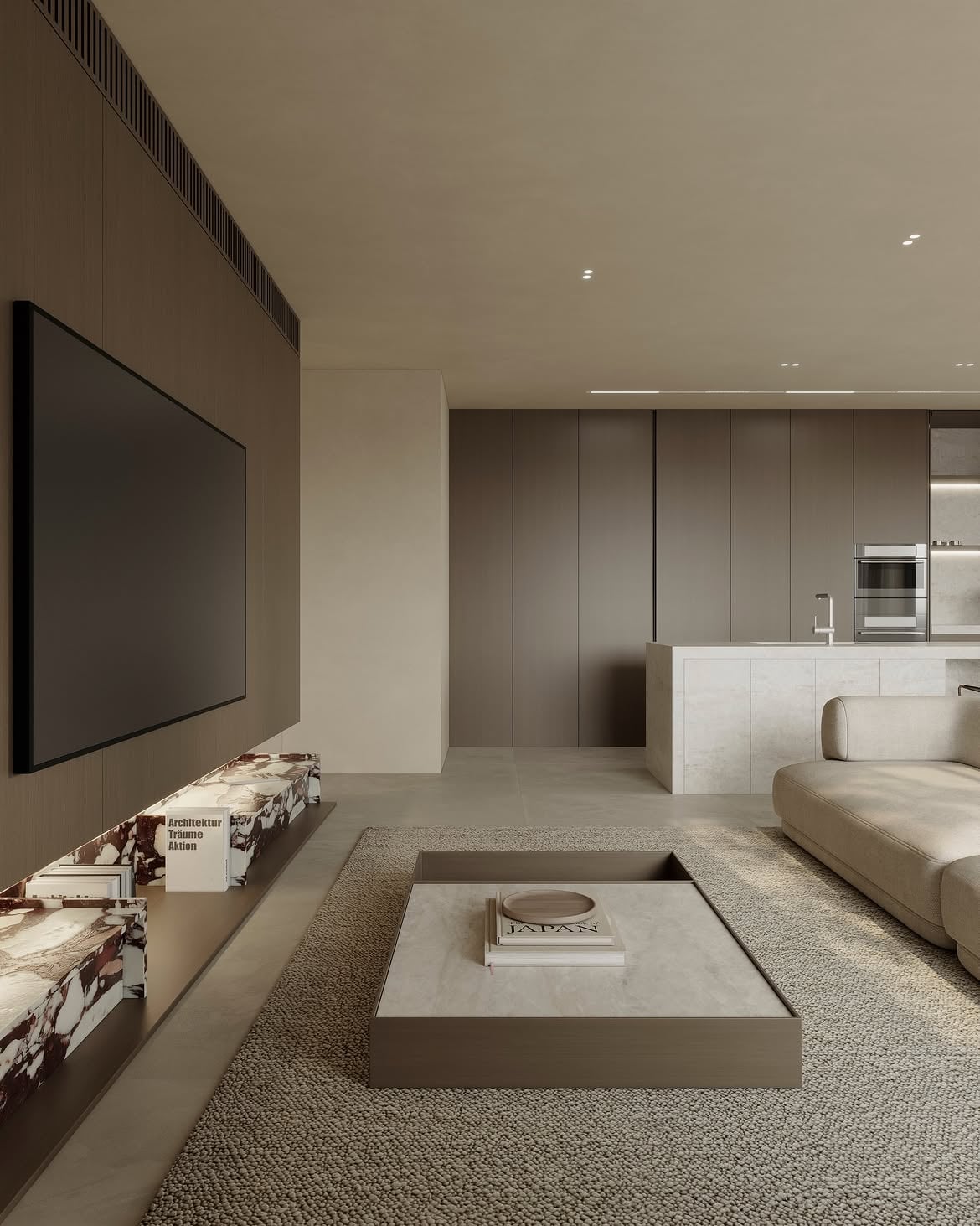Vista del living con televisión, mesa baja y cocina integrada al fondo